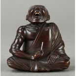 Japanese wood netsuke: featuring a 'Professional Sneezer', signed [Hidekazu], approx. 2.75"h