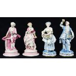 (lot of 4) Continental porcelain figurines, each depicted in period attire, all with underglaze