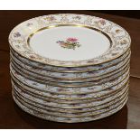 (lot of 12) Limoges polychrome decorated service plates, each having a partial gilt and floral