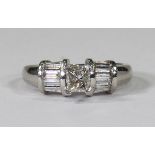 Diamond and platinum ring featuring (1) princess-cut diamond, weighing a total of approximately 0.35