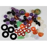 (Lot of 75) Unmounted, carved stones and beads comprised of (12) carved amethyst beads, ranging in