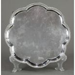 Georgian style sterling silver salver, by T.W, London, the scalloped and gadrooned form raised on