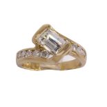 Diamond and 14k yellow gold ring featuring (1) emerald-cut diamond, weighing approximately 1.10