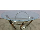 Italian Moderne style glass and brass coffee table, having a circular plate glass top with frosted