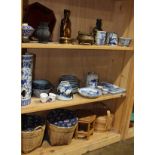 Three shelves of Chinese decorative art, including underglaze blue porcelain; bronze censer and