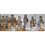 (lot of 18) Continental bisque figural sculptures, most depicted in Classical attire, including