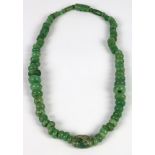 Pre-Columbian necklace, circa AD500-900, re-strung, of small fine greenstone and jade beads,