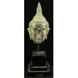 Thai patinated bronze head of a Ayutthaya Buddha, the long pointed face with arched eyebrows and