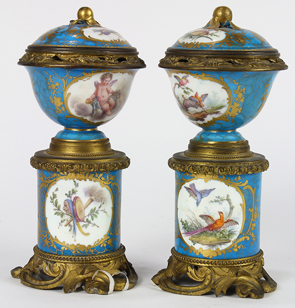 Pair of Sevres style cylindrical lidded urns, each having floral reserves and accented with gilt - Image 3 of 8