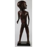 Tanzania, impressive male figure standing erect, fine-grained and appropriately hard wood with