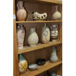 (lot of 11) Three shelves of Chinese ceramics, including a Cizhou type pillow and vases; a green and