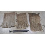 (lot of 4) Indigenous group including three grass skirts, and a carved wood instrument