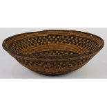 Antique Apache basketry bowl, having a tapered form decorated with abstract geometric designs, 3.5"h