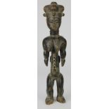 Ghana Akan-speaking peoples elaborately carved standing wood figure with raised scarifications,