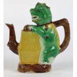 Chinese glazed ceramic puzzle pot, in the form of a green fu-lion standing on hind legs and