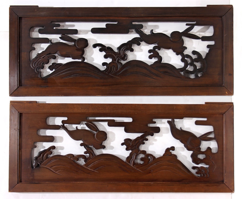 Pair of Japanese architectural wood panels, possibly ranma, open work with two hares jumping over