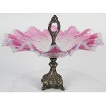 Late Victorian silver-plated and glass epergne, the blown glass bowl with a cranberry and opalescent