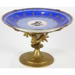 Sevres porcelain tazza, having gilt enamel accents on a 'Bleu du Roi" ground, rising on a gilt metal