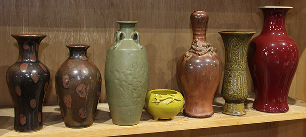 (lot of 7) One shelf of Chinese ceramics, consisting of six vases, of various colored glazes