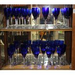 (lot of 24) Two shelves of cobalt to clear wine glasses, each having a clear stem