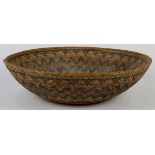 Rare and unusual Southern mission basketry bowl, having a tapered form with polychrome geometric