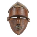 Lwalwa D.R. Congo carved wood mask, with protruding domed forehead, nose, and mouth, in a typical