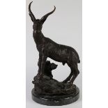 Patinated metal sculpture, depicting an African gazelle, rising on a naturalistic base and granite