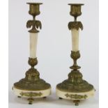 Pair of Neoclassical style ormolu and patinated bronze candlesticks, late 19th century, each