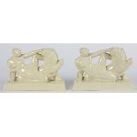 Pair of Art Deco figural bookends, each depicting a nude beauty conjoined with a seated lion,