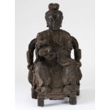 Chinese figural wood carving, with a seated female carrying a child holding an ingot, 15"h