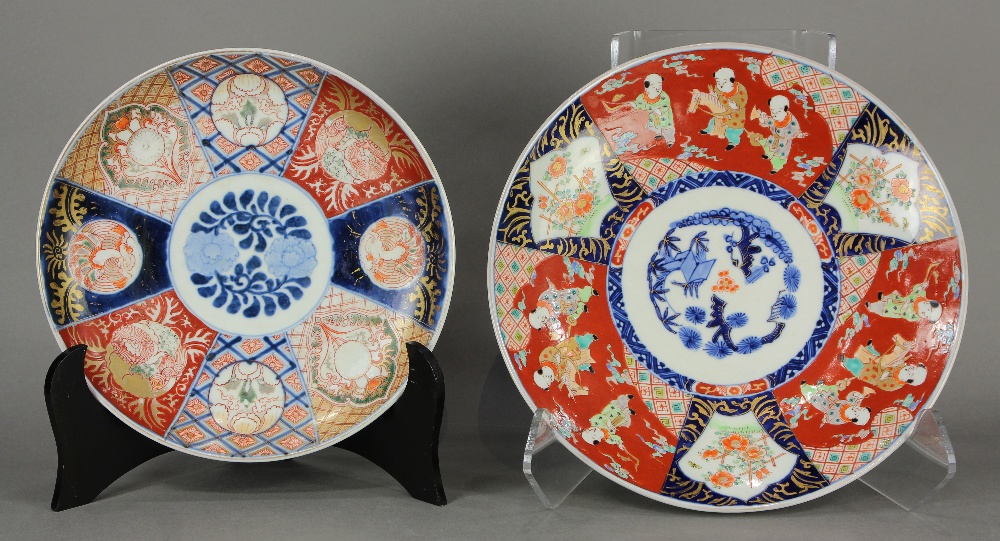 (lot of 2) Japanese Imari chargers: the first, with Three Friends of Winter in blue-and-white and