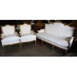 (lot of 3) Louis XVI style giltwood salon suite, each having a floral decorated crest, above a cream