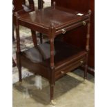 Regency style occasional table, having a rectangular top with pull out tray above a lower tier and