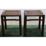 Pair of Chinese wooden stools, of square section with a woven top, above a humpback apron and raised