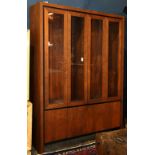 Mid Century modern hutch, circa 1970, the four-door case with inset glass panels opening to a fitted