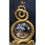 Regency style gilt framed looking glass, decorated with stylized dolphins centering a convex looking