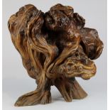 Asian style sculptural driftwood centerpeice, accented with knots and burled designs, in the form of