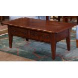 Moderne occasional table, having a rectangular top, above two drawers, and rising on tapered legs,