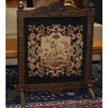 Continental Rococo style firescreen, having a carved frame centered with a shell carved medallion,