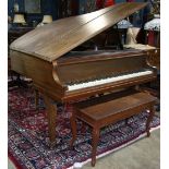 Brambach baby grand piano, having a mahogany case and rising on tapered legs terminating on