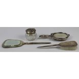 (lot of 4) Dresser group consisting of a hammered sterling mounted hand mirror and hair brush;