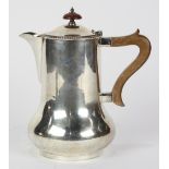 English sterling silver milk jug, by Henry Wilkinson, Sheffield, 1934, the classic shouldered to