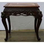 Japanese wooden table, Meiji period, iris carving on the apron and raised on cabriole supports,