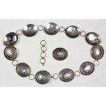 Sterling silver belt composed of (11) oval sterling silver conchos, measuring approximately 61.4 x