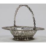 English George III sterling silver basket, London, 1760, the pierced bowl set with a repoussé