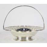 Tiffany & Company sterling silver basket featuring repeating stylized reserves, mounted with a