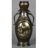 Japanese patinated bronze vase, Meiji period, with a garlic-head above the zoomorphic handles, a