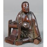 Japanese wooden netsuke, 19th century, 'Seated Monk' with the signature [Hoju], 2"h