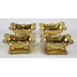 (lot of 4) English George III sterling silver-gilt pedestal open salts, by R.G, possibly Robert