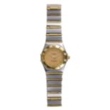 Lady's Constellation two-tone wristwatch Dial: round, textured diamond pattern, gold tone, applied